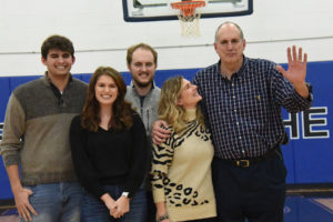 Steve Krafcisin (right) is accompanied by his family, son Gabe; daughter, Grace; son, Jake and wife, Joanne at the retirement ceremony. 